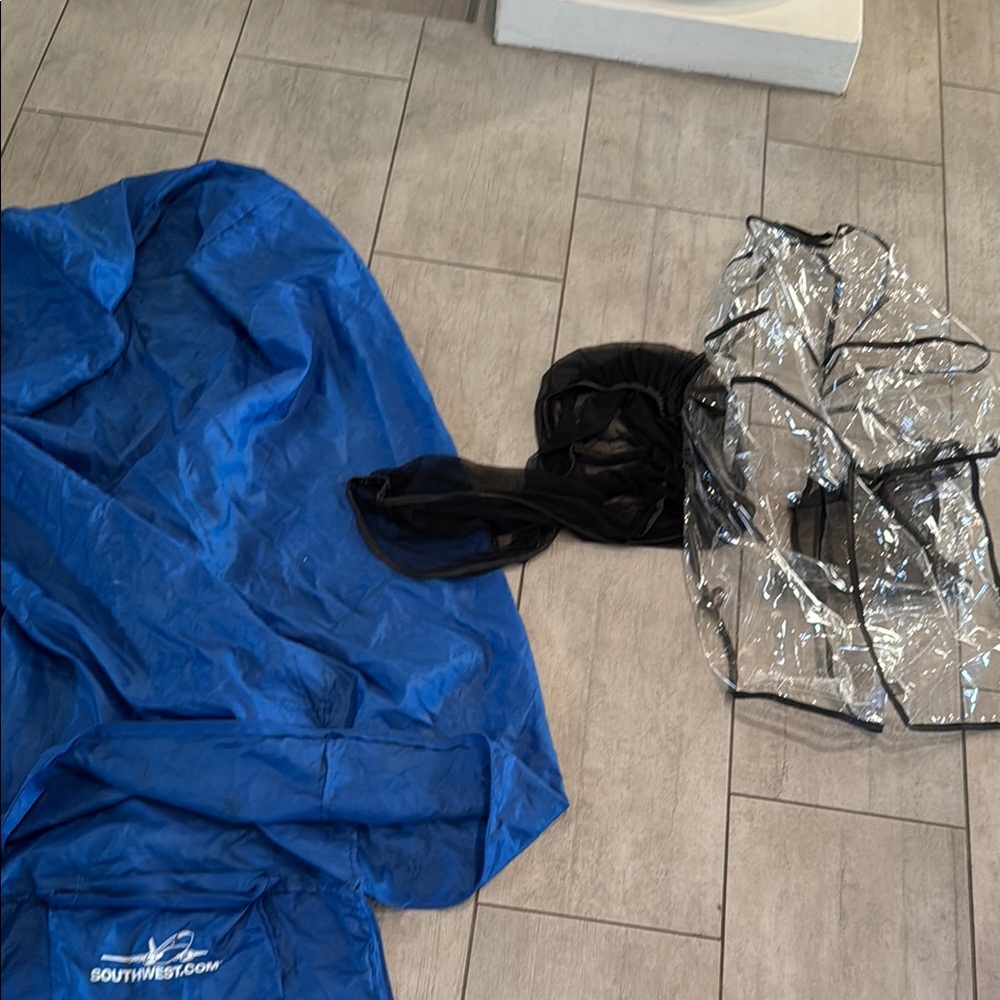 Stroller accessories: rain shield, bug/sun protector and airplane travel bag